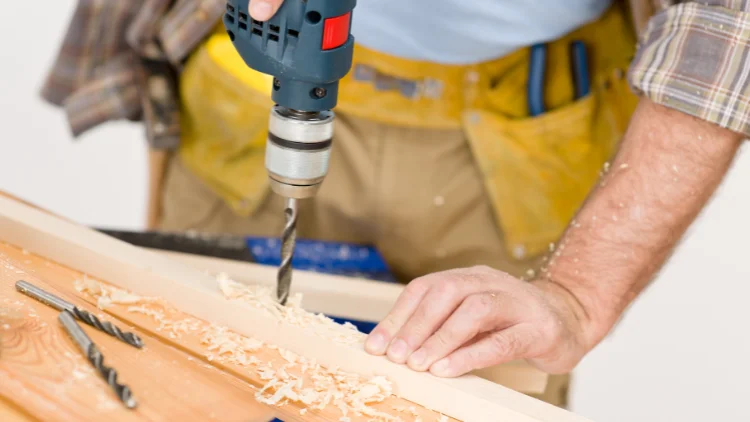 Drilling holes in wood using a twist drill bit